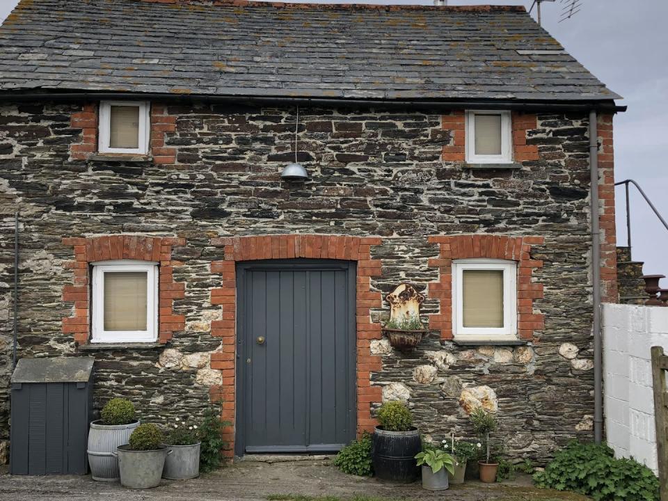 <p>Set within acres of wildflower meadows, this rustic barn is excellent for holiday makers looking to get away from it all. </p><p>'Our cottage offers a chance to explore the wild wonderful coast of North Cornwall at its best,' say the hosts. 'Outside is a small fenced garden with seating and table, gloriously covered with lichen, in which to sit and sip wine and take in our fabulous views.'</p><p><a class="link " href="https://www.airbnb.co.uk/rooms/4027491" rel="nofollow noopener" target="_blank" data-ylk="slk:BOOK VIA AIRBNB">BOOK VIA AIRBNB</a></p>