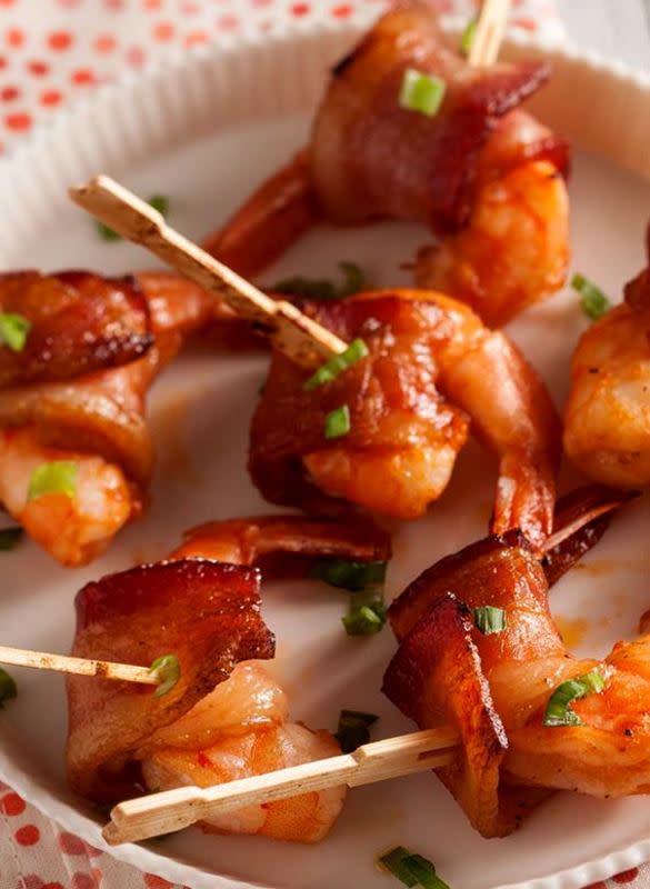 <p>Mark Boughton Photography</p><p>These apps come together in no time. Serve them with a toothpick to avoid messy hands. </p><p><strong>Get the recipe:<a href="https://parade.com/842237/communitytable/3-ingredient-app-barbecue-bacon-wrapped-shrimp-bites/" rel="nofollow noopener" target="_blank" data-ylk="slk:Bacon Wrapped Shrimp;elm:context_link;itc:0;sec:content-canvas" class="link "> Bacon Wrapped Shrimp</a></strong></p>