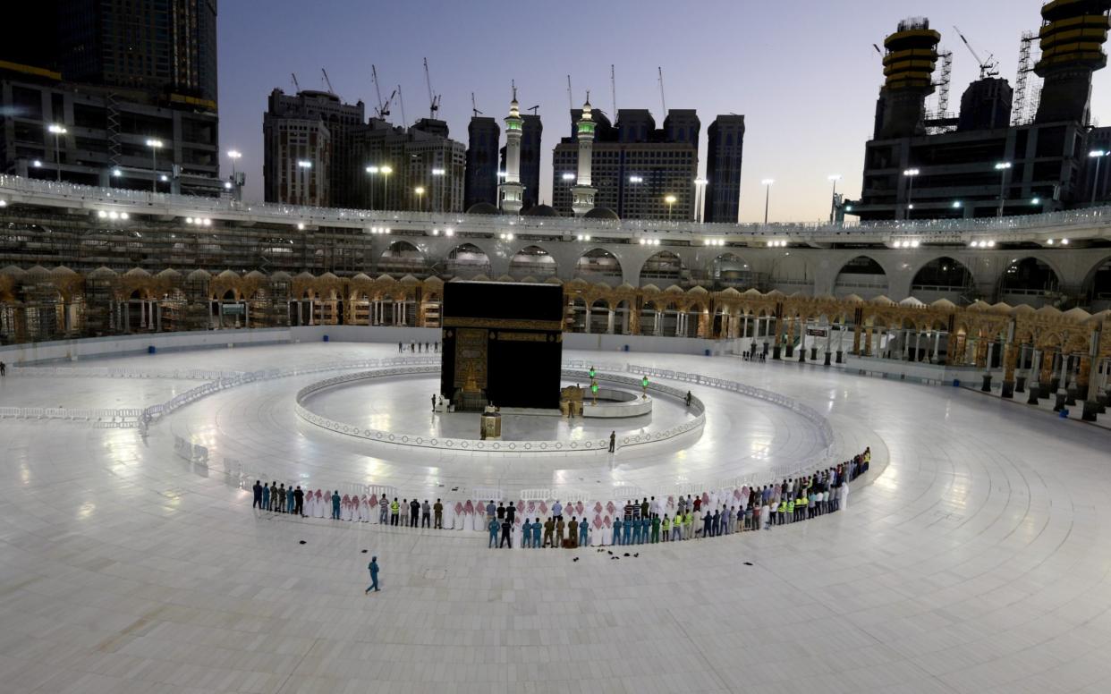 Worshippers perform Taraweeh prayer at Kaaba in the Grand Mosque on the first day of the holy month of Ramadan during the outbreak of the coronavirus disease - Reuters