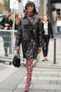 <p><strong>1 October</strong> Naomi Campbell sat on the front row for the Le Defile L'Oreal Paris<span> show in Paris wearing a eye-catching red patterned outfit with matching boots and a sheer shiny coat. </span></p>