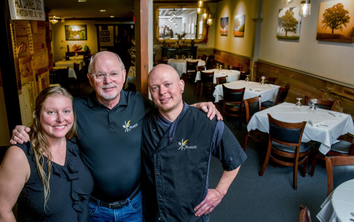 Hugh Higgins, middle, owner of Hearth Restaurant, his daughter, left, and restaurant manager Rachel Klein, and son, head chef Seth Higgins are celebrating the ten-year anniversary of the upscale eatery in Peoria Heights.