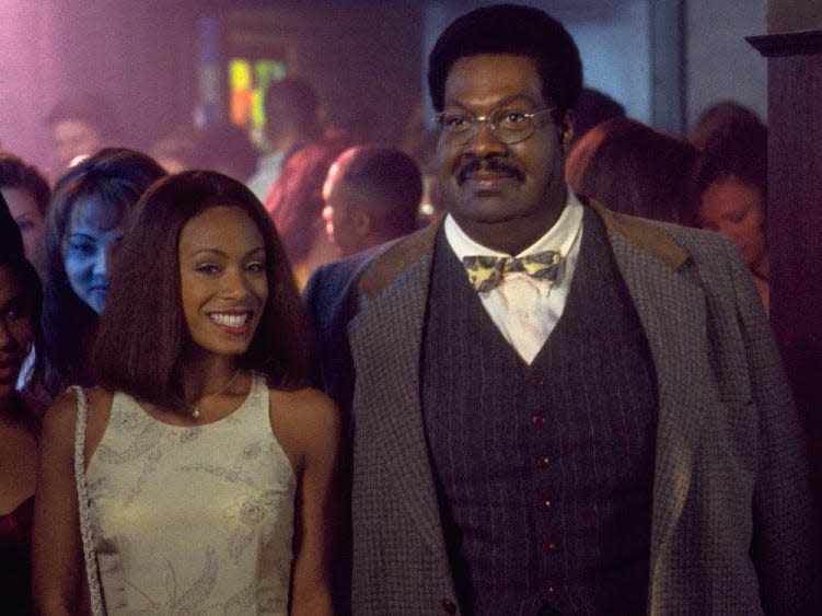 Jada Pinkett Smith standing next to Eddie Murphy