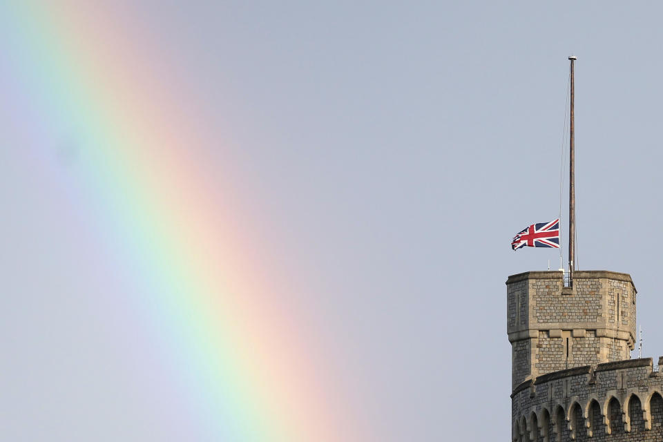 WINDSOR, ENGLAND - SEPTEMBER 08: (EDITORS NOTE: Retransmission with alternate crop.) The Union flag is lowered on Windsor Castle as a rainbow covers the sky on September 08, 2022 in Windsor, England. Elizabeth Alexandra Mary Windsor was born in Bruton Street, Mayfair, London on 21 April 1926. She married Prince Philip in 1947 and acceded the throne of the United Kingdom and Commonwealth on 6 February 1952 after the death of her Father, King George VI. Queen Elizabeth II died at Balmoral Castle in Scotland on September 8, 2022, and is survived by her four children, Charles, Prince of Wales, Anne, Princess Royal, Andrew, Duke Of York and Edward, Duke of Wessex.  (Photo by Chris Jackson/Getty Images)