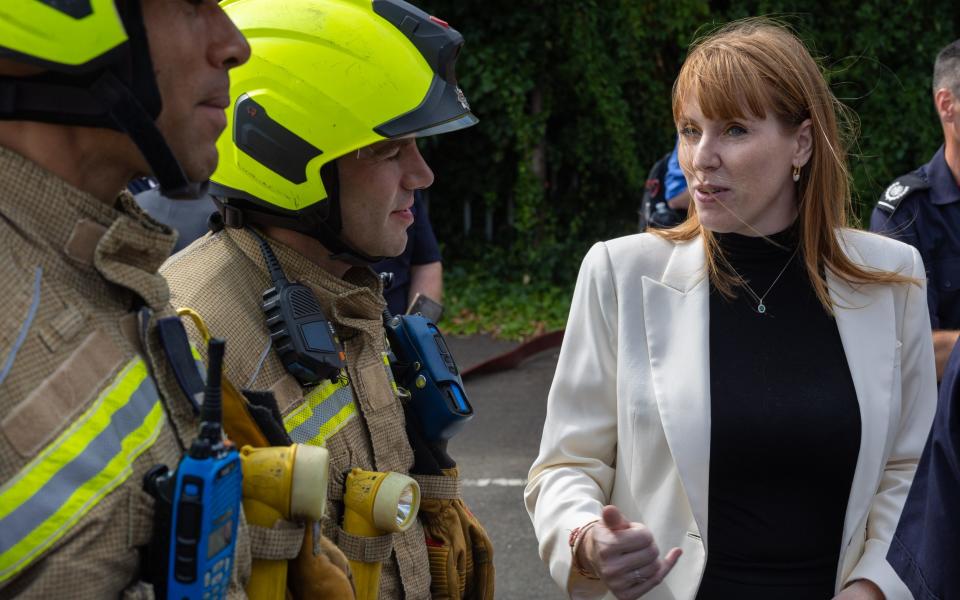 Angela Rayner meets firefighters at the scene of a residential fire in Dagenham, East London