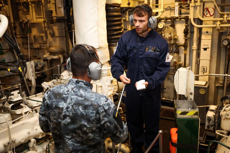 A Ukrainian sailor (left) undergoes training on a minehunter (MoD/PA)