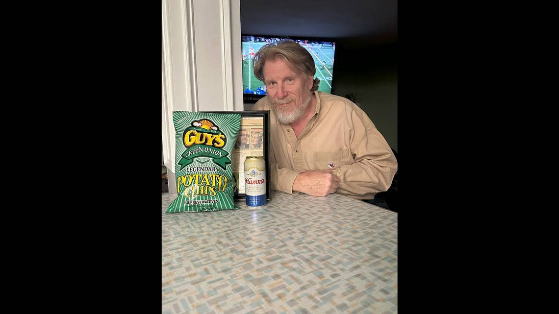 Daniel Dodson sits with the Guy’s Chips and Hamm’s beer he has during every Chiefs game. Courtesy of Daniel Dodson.