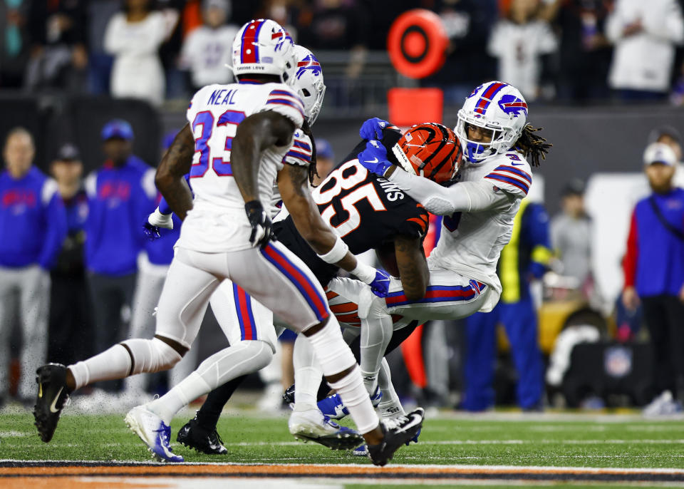 Damar Hamlin #3 of the Buffalo Bills tackles Tee Higgins #85 of the Cincinnati Bengals during the first quarter of an NFL football game at Paycor Stadium on January 2, 2023, in Cincinnati, Ohio. / Credit: Kevin Sabitus / Getty Images