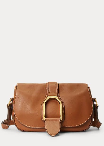 <p><a href="https://go.redirectingat.com?id=74968X1596630&url=https%3A%2F%2Fwww.ralphlauren.com%2Fwomen-accessories-handbags%2Fcalfskin-welington-shoulder-bag%2F0044781326.html&sref=https%3A%2F%2Fwww.townandcountrymag.com%2Fstyle%2Ffashion-trends%2Fa43975155%2Ftaylor-swift-ralph-lauren-bag-nyc-photos%2F" rel="nofollow noopener" target="_blank" data-ylk="slk:Shop Now;elm:context_link;itc:0;sec:content-canvas" class="link ">Shop Now</a></p><p>Calfskin Welington Shoulder Bag</p><p>$1690.00</p><p>ralphlauren.com</p>