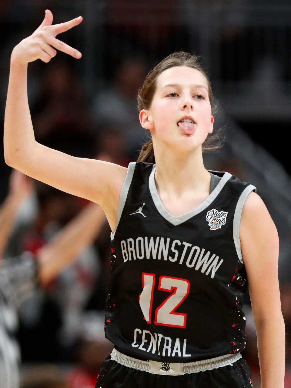 Brownstown Central Braves Harley Toppe (12) reacts after scoring during the IHSAA girls basketball Class 2A state championship against the Fort Wayne Bishop Luers Knights, Saturday, Feb. 24, 2024, at Gainbridge Fieldhouse in Indianapolis. Bishop Luers Knights won 44-36.