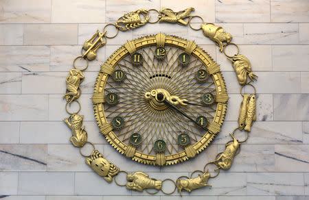 FILE PHOTO: The "zodiac" clock is seen inside Palazzo delle Colonne inside Intesa San Paolo bank downtown Milan, Italy, November 13, 2017. REUTERS/ Stefano Rellandini/File Photo