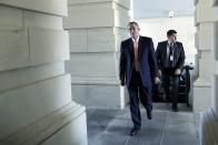 U.S. House Speaker John Boehner (R-OH) (2nd R) arrives with his security detail at the U.S. Capitol in Washington, September 30, 2013. The Senate is expected to strip from the government spending bill amendments that delay President Obama's healthcare law, a move that throws the political hot potato back to Republican House Speaker John Boehner, as the first government shutdown in 17 years looms. REUTERS/Jonathan Ernst (UNITED STATES - Tags: POLITICS BUSINESS)