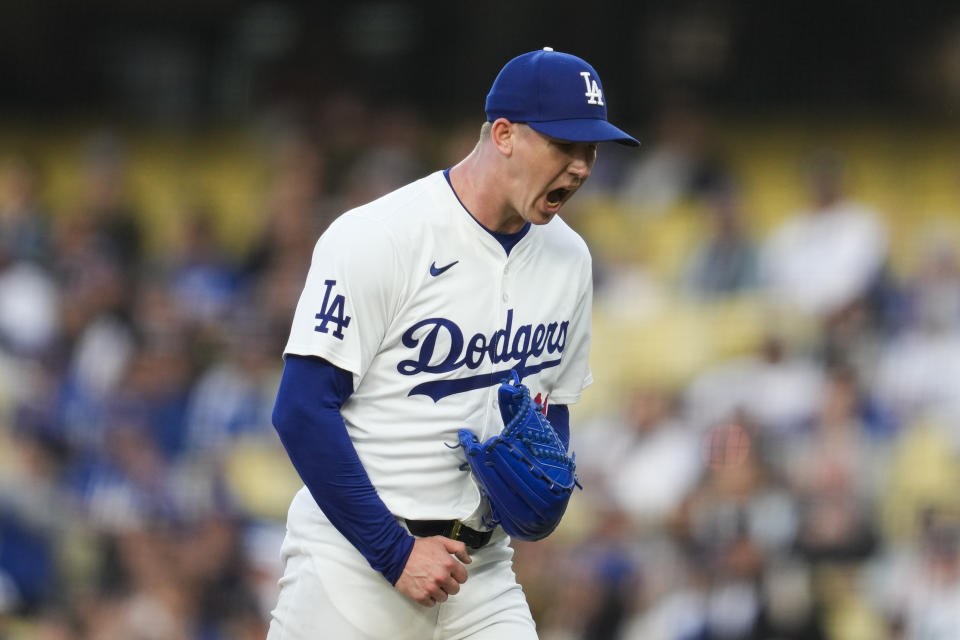 Los Angeles Dodgers starting pitcher Walker Buehler reacts after the first inning of a baseball game against the Colorado Rockies in Los Angeles, Friday, May 31, 2024. (AP Photo/Ashley Landis)