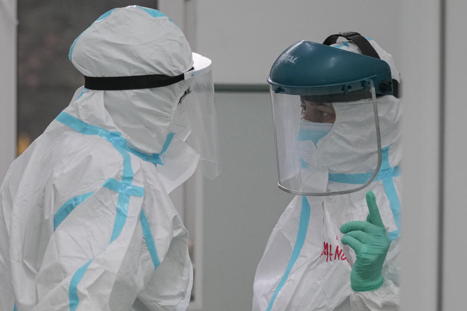 A medic gestures at the COVID-19 ICU unit of the Marius Nasta National Pneumology Institute in Bucharest, Romania, Thursday, Sept. 23, 2021. Daily new coronavirus infections in Romania, a country of 19 million, have grown exponentially over the last month, while vaccine uptake has declined to worrying lows. Government data shows that 91.5% of COVID-19 deaths in Romania between Sept. 18-23 were people who had not been vaccinated. (AP Photo/Vadim Ghirda)