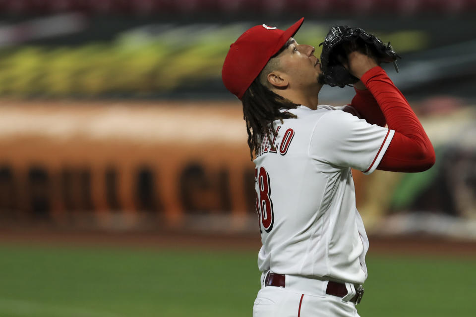 Cincinnati Reds' Luis Castillo reacts as he walks to the dugout in the fifth inning during a baseball game against the Milwaukee Brewers in Cincinnati, Monday, Sept. 21, 2020. (AP Photo/Aaron Doster)