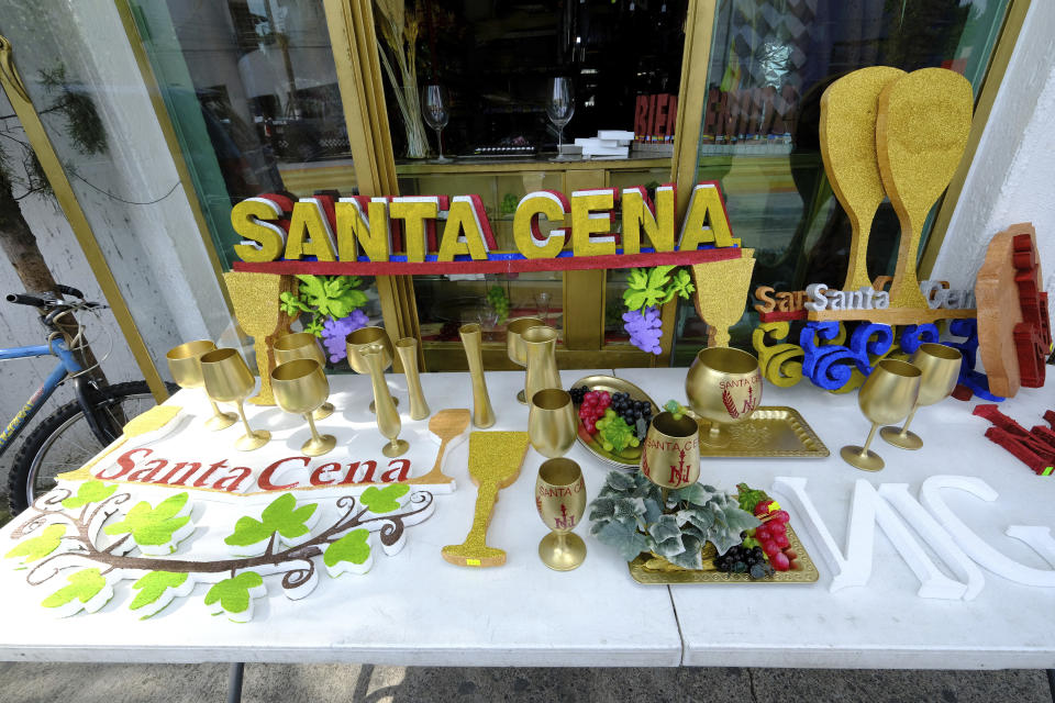 Merchandise for celebrating the Santa Cena or Holy Supper are displayed for sale on the grounds of the La Luz del Mundo or the Light of the World flagship temple in Guadalajara, Mexico, Saturday, Aug. 13, 2022. Thousands gathered to pray for their absent leader, Naason Joaquin Garcia, during their Holy Supper, the most sacred festivity for La Luz del Mundo. Garcia addressed the congregation by telephone from his Los Angeles prison, where he is serving a 16-year sentence after pleading guilty to sexually abusing minors. (AP Photo/Refugio Ruiz)
