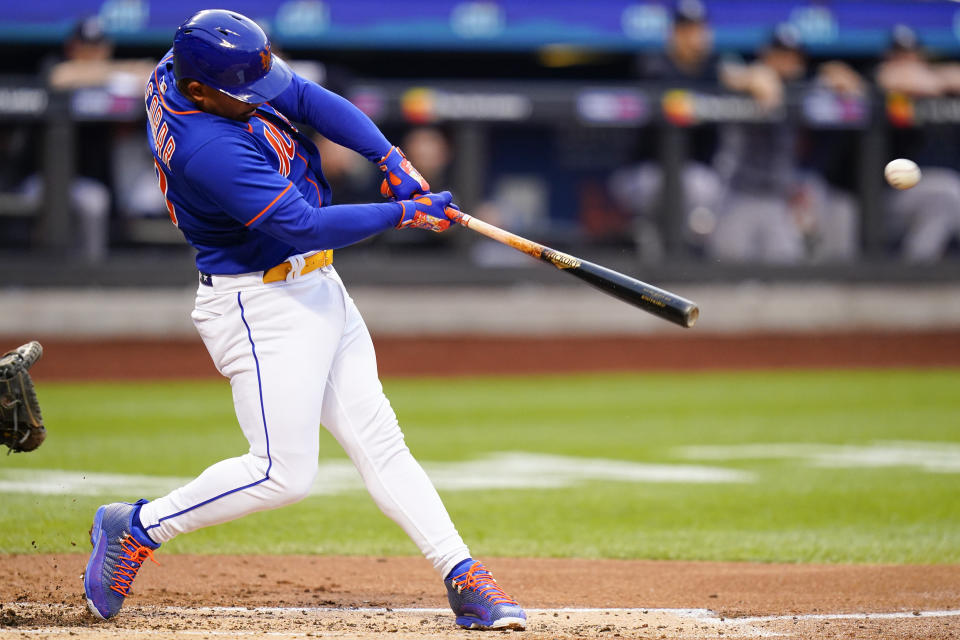 New York Mets' Eduardo Escobar hits a two-run home run during the first inning of a baseball game against the New York Yankees Tuesday, July 26, 2022, in New York. (AP Photo/Frank Franklin II)