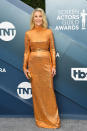 O'Hara sported one of the biggest trends of awards season wither her orange belted gown by Marc Jacobs and metallic accessories.