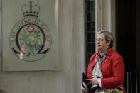 Joanna Cherry, the Scottish National Party's Justice and Home Affairs spokesperson, poses for photographers as she arrives at the Supreme Court in London, Tuesday Sept. 17, 2019. The Supreme Court is set to decide whether Prime Minister Boris Johnson broke the law when he suspended Parliament on Sept. 9, sending lawmakers home until Oct. 14 — just over two weeks before the U.K. is due to leave the European Union. (AP Photo/Matt Dunham)