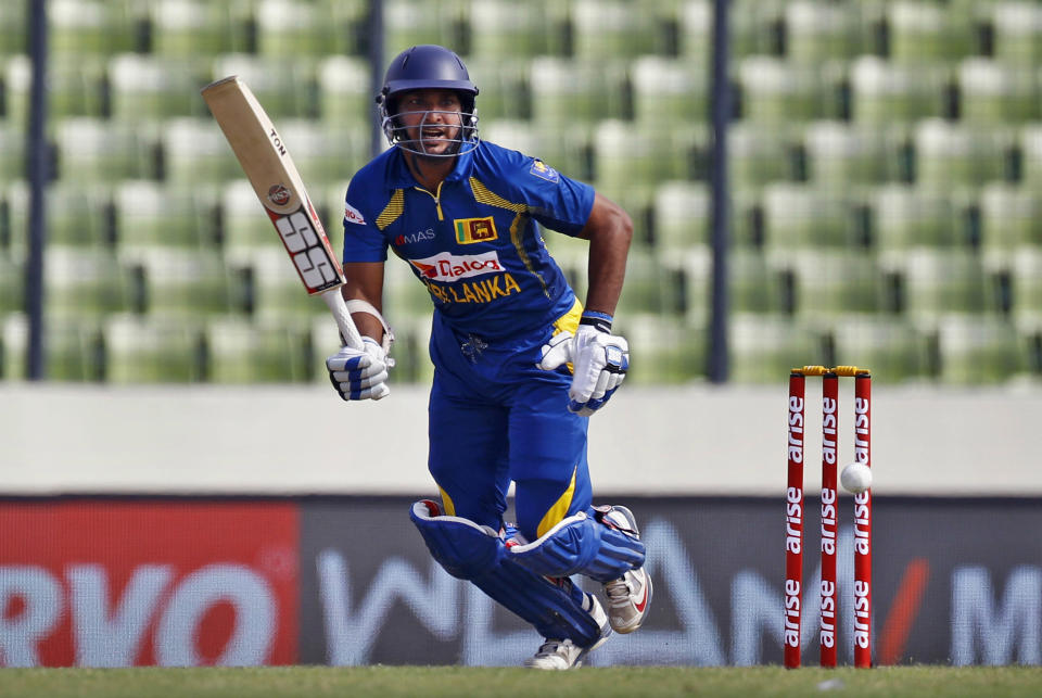 Sri Lanka’s Kumar Sangakkara plays a shot during the Asia Cup one-day international cricket tournament against Afghanistan in Dhaka, Bangladesh, Monday, March 3, 2014. (AP Photo/A.M. Ahad)