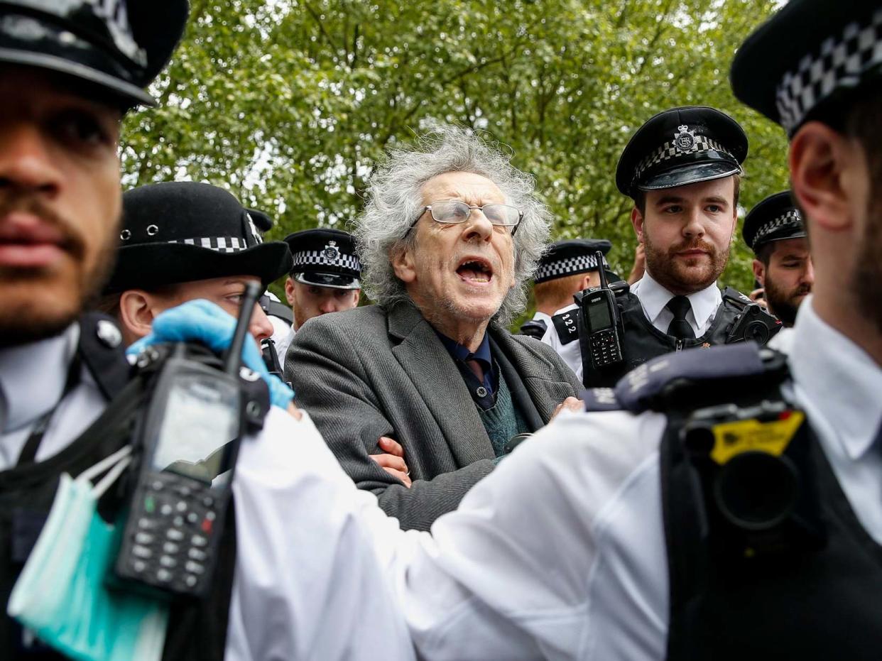 Police officers apprehend Piers Corbyn, Jeremy Corbyn's brother, during a demonstration against the coronavirus lockdown in Hyde Park on 16 May: Hollie Adams/Getty Images