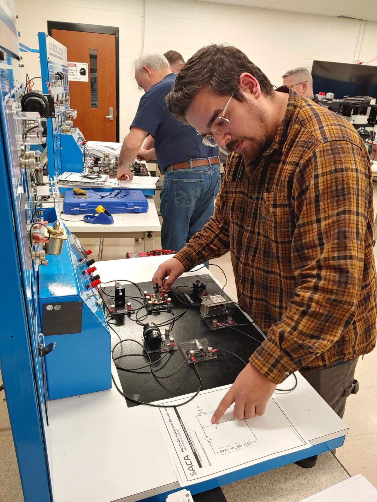 Gabriel Castillo uses equipment at the Bloomington Ivy Tech campus this month as part of his industrial electrical course in preparation for a certification exam.