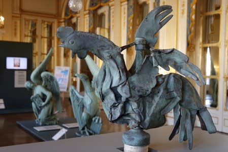 The iconic copper rooster, which was perched at the top of the spire of Notre-Dame Cathedral for more than a century is displayed at the exhibition "Revoir Notre-Dame de Paris\