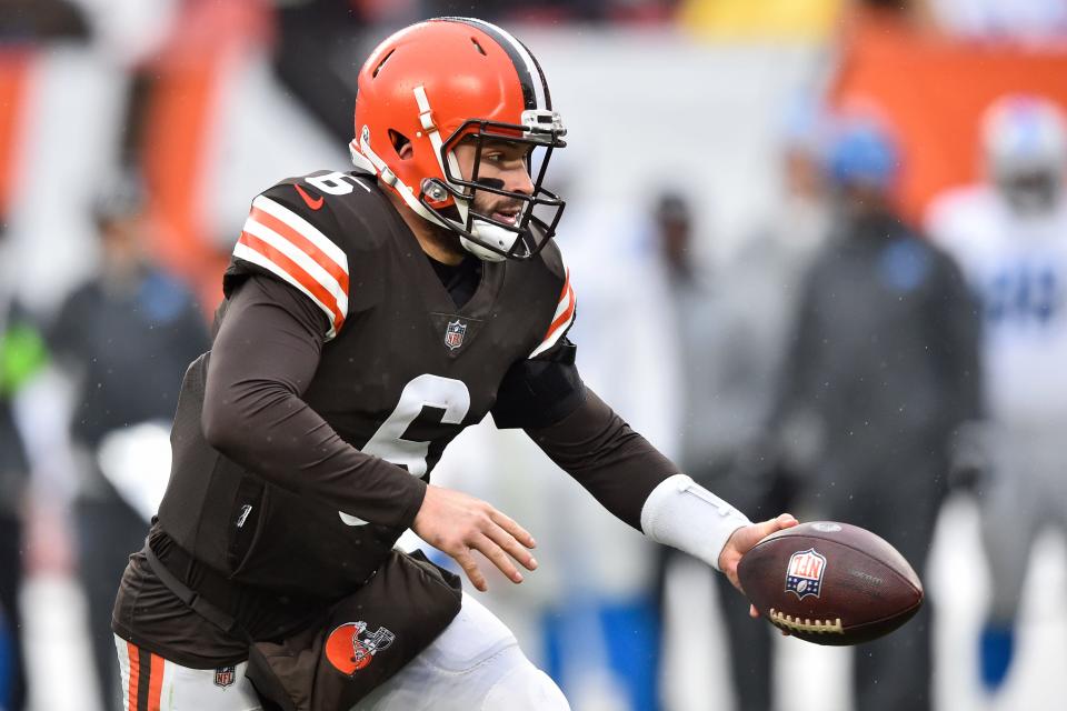 Cleveland Browns quarterback Baker Mayfield hands the ball off during the second half of an NFL football game against the Detroit Lions, Sunday, Nov. 21, 2021, in Cleveland. (AP Photo/David Richard)