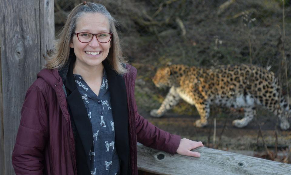 Erie Zoo CEO Melissa "Roo" Kojancie is shown near Amur leopard Nia at the zoo in Erie on Jan. 31.