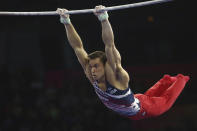 Samuel Mikulak of the United States performs on the horizontal bar in the men's all-around final at the Gymnastics World Championships in Stuttgart, Germany, Friday, Oct. 11, 2019. (AP Photo/Matthias Schrader)