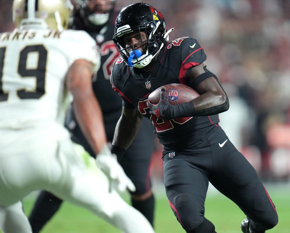 Oct 20, 2022; Glendale, Arizona, United States; Arizona Cardinals running back Eno Benjamin (26) carries the ball against the New Orleans Saints at State Farm Stadium.