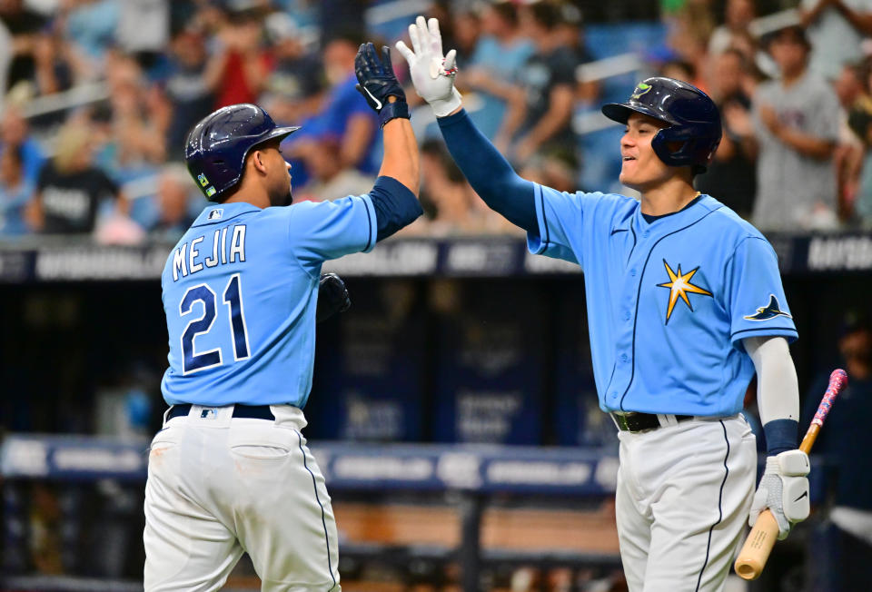 ST PETERSBURG, FLORIDA - JULY 17: Francisco Mejia #21 of the Tampa Bay Rays celebrates with Yu Chang #9 after hitting a home run in the sixth inning against the Baltimore Orioles at Tropicana Field on July 17, 2022 in St Petersburg, Florida. (Photo by Julio Aguilar/Getty Images)