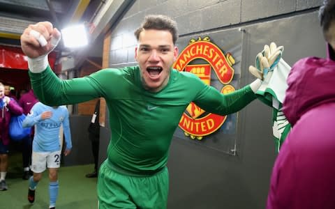 Ederson of Manchester City celebrates after their win against Manchester United - Credit: Getty