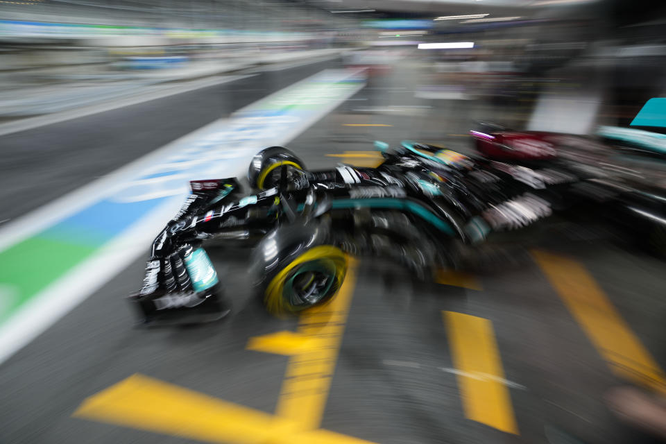 Mercedes driver Lewis Hamilton of Britain leaves the pit lane during practice session for the Saudi Arabian Grand Prix in Jiddah, Friday, Dec. 3, 2021. (AP Photo/Hassan Ammar)