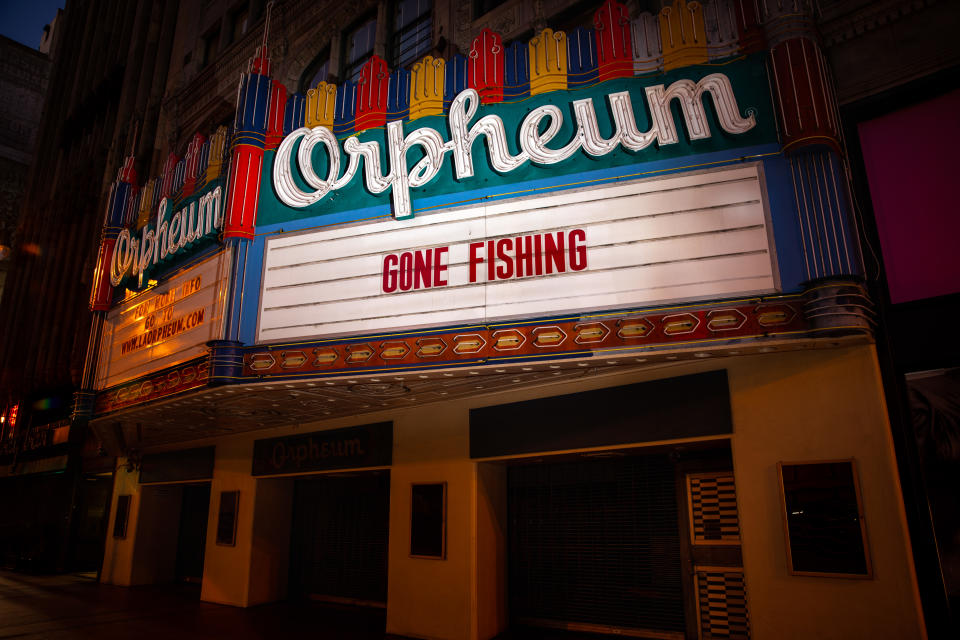 LOS ANGELES, CA - APRIL 23: The historic Orpheum Theatre, originally opened in 1926, is closed and its marquee dark, with the words, Gone Fishing, in downtown Los Angeles, CA, during the coronavirus pandemic, photographed Thursday, April 23, 2020. (Jay L. Clendenin / Los Angeles Times via Getty Images)