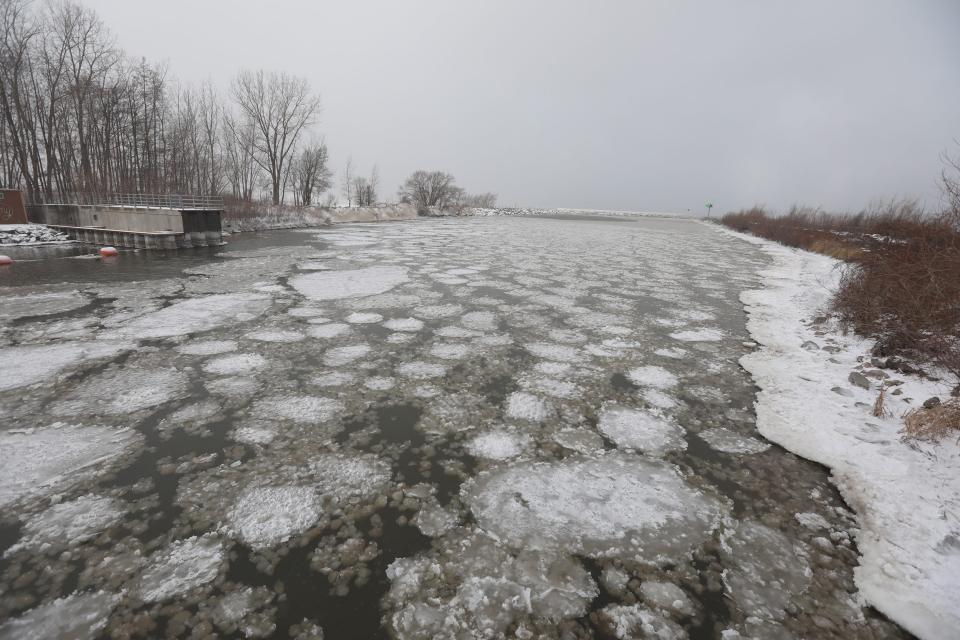 Ice pancakes and ice balls from Lake Ontario flow into Irondequoit Bay near the Irondequoit Bay Outlet Bridge Feb. 3, 2023.