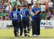 Britain Cricket - England v Pakistan - Fourth One Day International - Headingley - 1/9/16 England's Liam Plunkett celebrates taking the wicket of Pakistan's Babar Azam with Moeen Ali and teammates Action Images via Reuters / Lee Smith Livepic