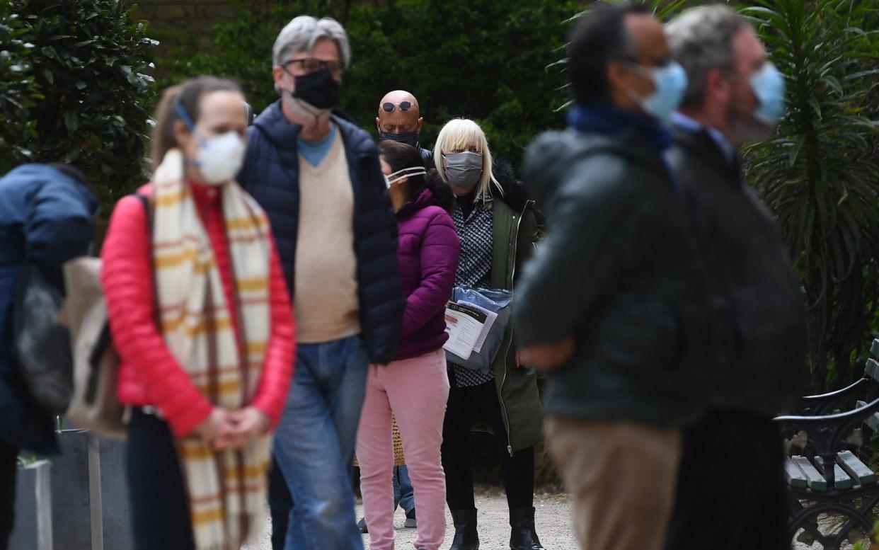 Members of the public queue for the COVID-19 testing centre at St John's Church in Waterloo, south London - Victoria Jones/PA Wire