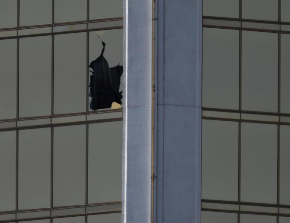 A broken window is seen at The Mandalay Bay Resort and Casino following a mass shooting at the Route 91 Festival (REUTERS/Mike Blake)