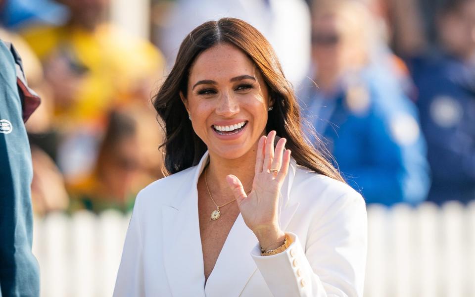 The Duchess of Sussex also attended the reception alongside her husband - Aaron Chown 