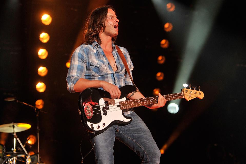 Kip Moore’s bassist Manny Medina performs at LP Field during the 2013 CMA Music Festival on June 7, 2013 in Nashville, Tennessee. (Photo by Frederick Breedon IV/WireImage)