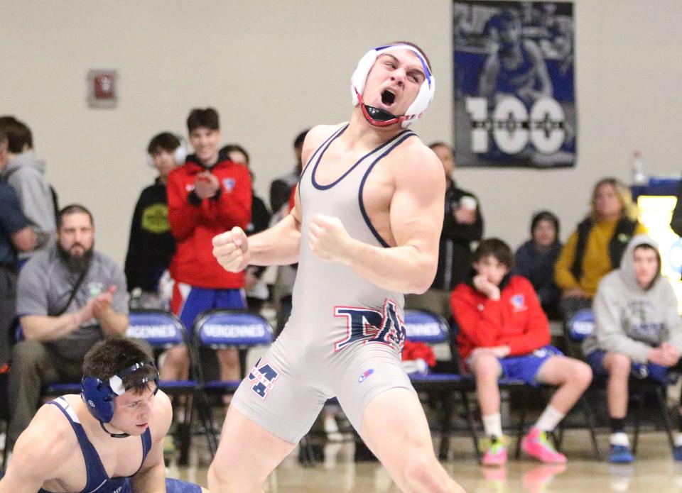 Mount Anthony's Aaron Johnson reacts after the final whistle in the 170 pound final at the 2023 Vermont State championships on Saturday night at Vergennes High School.