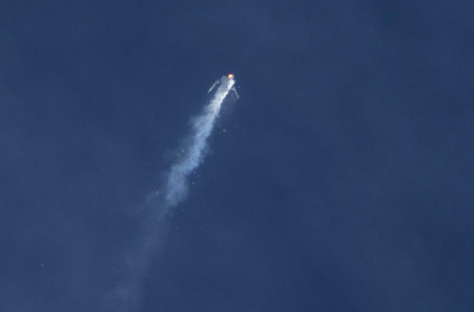 The Virgin Galactic SpaceShipTwo rocket explodes in mid-air above the Mojave Desert. (Reuters)