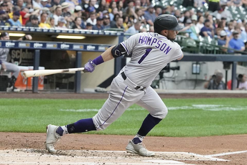 Colorado Rockies' Garrett Hampson hits a double during the third inning of a baseball game against the Milwaukee Brewers Monday, July 25, 2022, in Milwaukee. (AP Photo/Morry Gash)