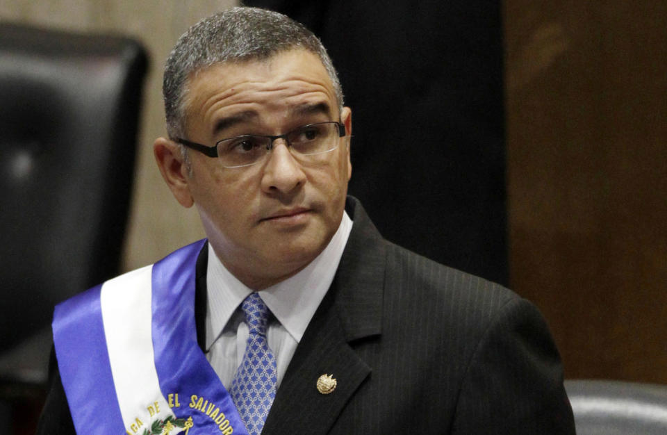 FILE - In this June 1, 2012 file photo, El Salvador's President Mauricio Funes stands in the National Assembly before speaking to commemorate the anniversary of his third year in office in San Salvador, El Salvador. Funes, who became president with the Farabundo Martí National Liberation Front party, is sought by prosecutors in El Salvador on corruption charges. He lives in exile in Nicaragua. (AP Photo/Luis Romero, File)