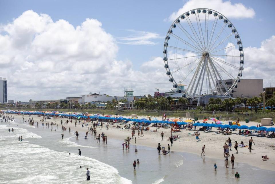 A view of the beach and SkyWheel looking south from Pier 14 in Myrtle Beach on July 4.