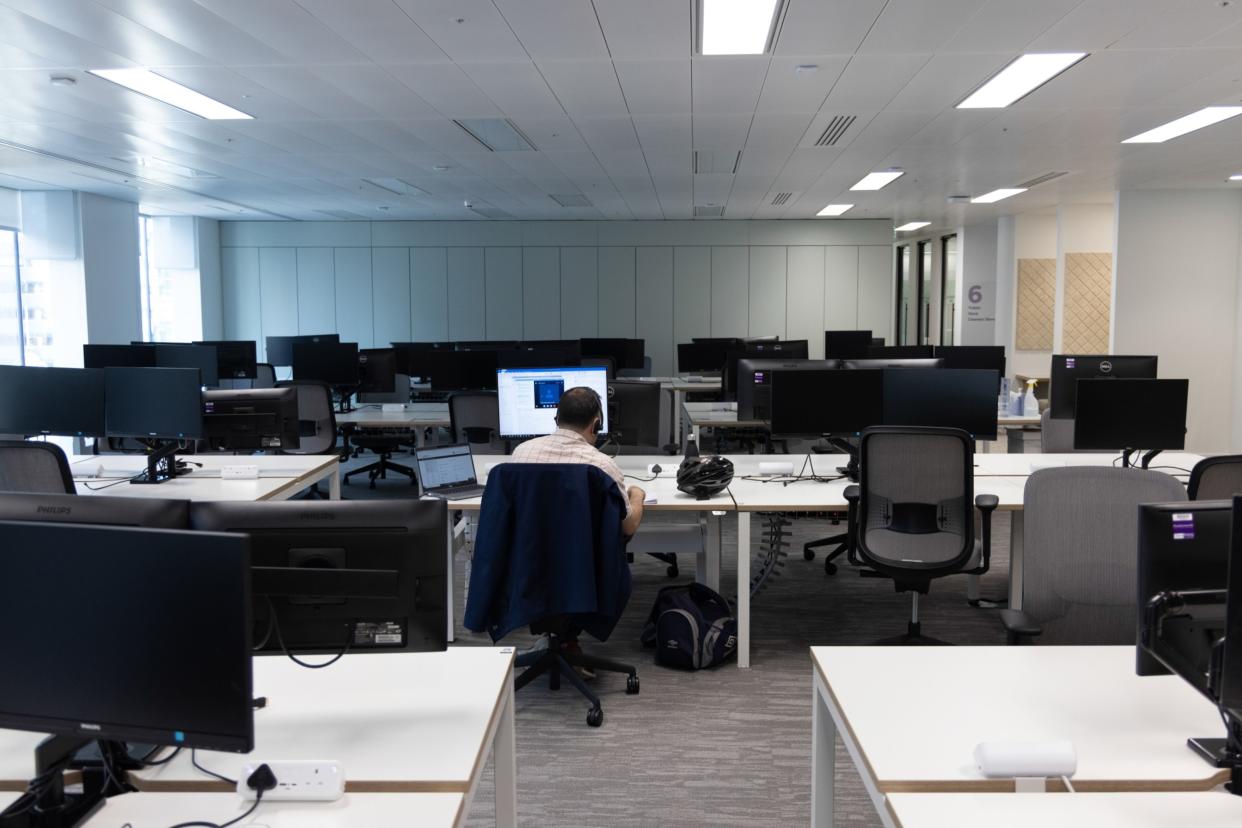 An office worker at a desk in London.