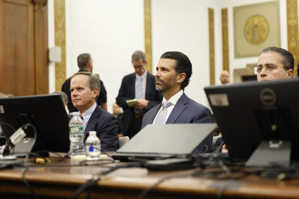 Donald Trump, Jr. sits in the courtroom with his legal team before the continuation of his civil business fraud trial at New York Supreme Court, Monday, Nov. 13, 2023, in New York. (Michael M. Santiago//Pool Photo via AP)