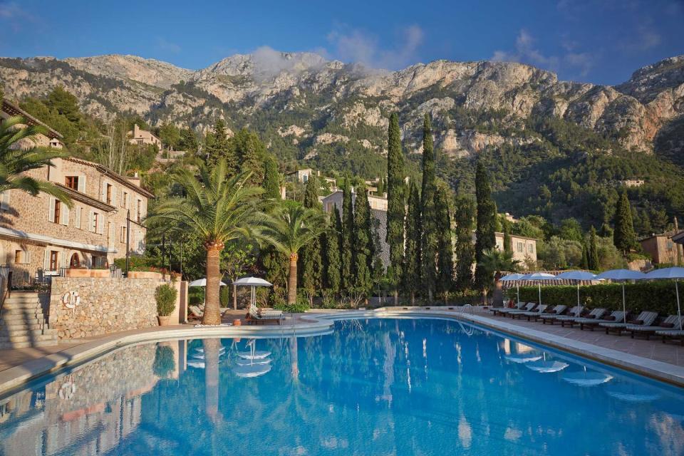 The palm tree lined pool at Belmond La Residencia. Belmond was voted one of the best hotel brands in the world