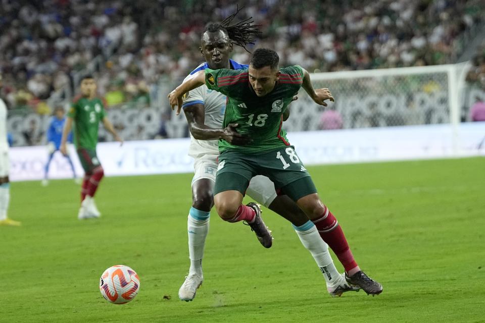 Mexico's Luis Chavez is pinned by Honduran Albert Elis during the first match of the Gold Cup, Sunday, June 25, 2023, in Houston.  (AP Photo/David J. Phillip)