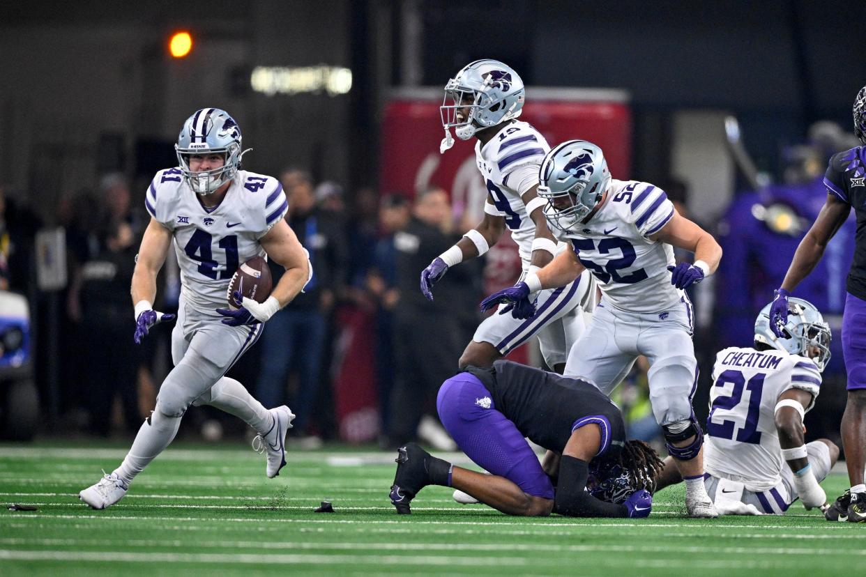 Kansas State linebacker Austin Moore (41) celebrates after recovering a fumble against TCU in last year's Big 12 championship game. Moore, who led the Wildcats in tackles, is one of five returning starters this year on defense.